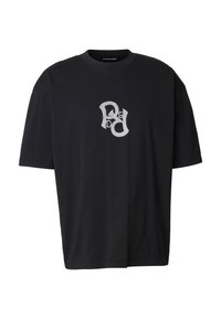 Camiseta de algodón negra con un logo gráfico blanco en el frente. Tiene un ajuste holgado, mangas cortas y cuello redondo.