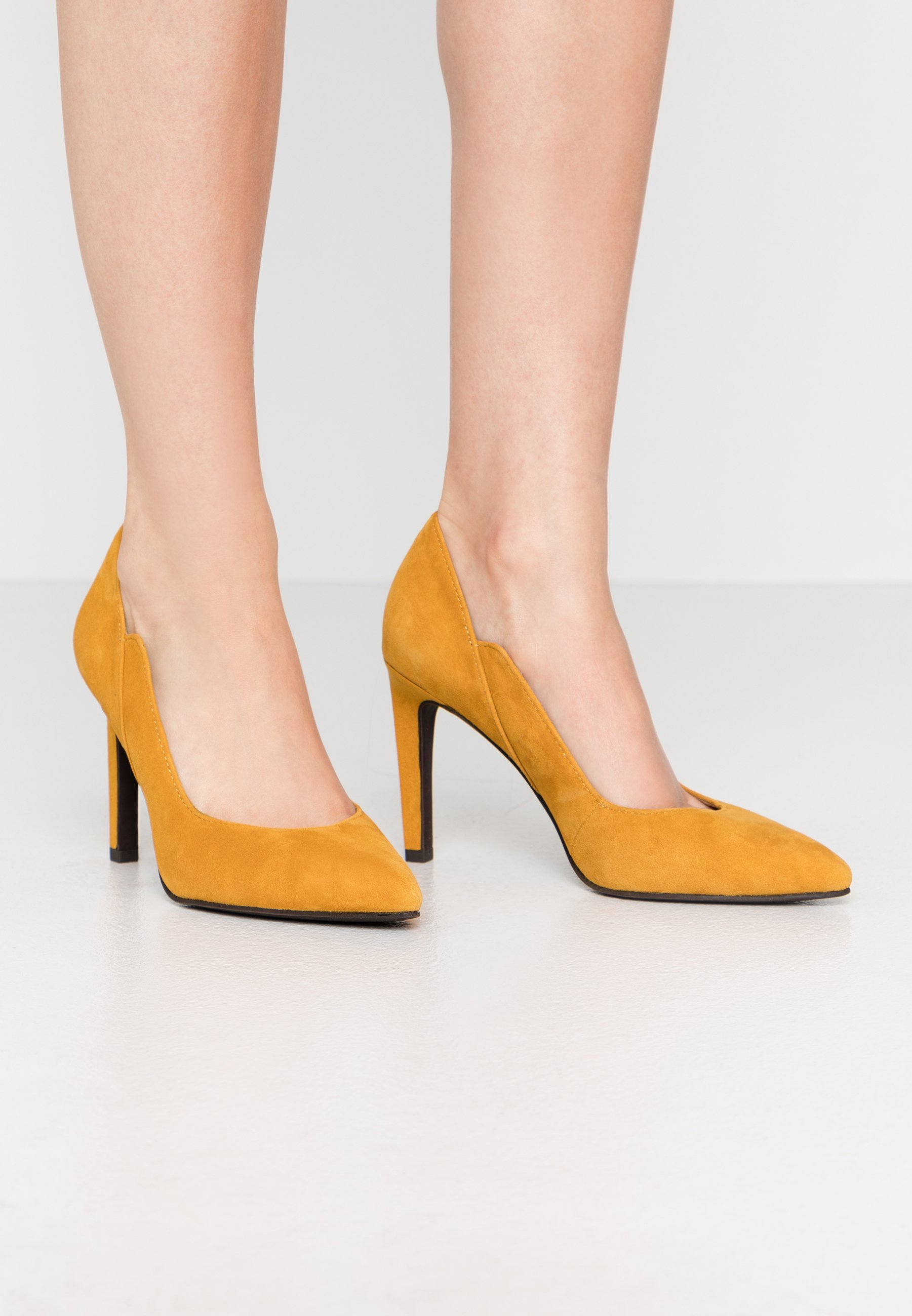 mustard high heels