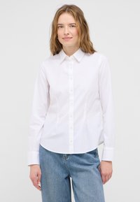 White button-up shirt made of smooth cotton fabric, featuring a classic collar, long sleeves, and a straight fit with a subtle logo on the chest.