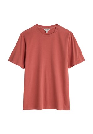 Lyhythihainen t-paita haalistuneen ruusunpunaisena, pehmeästä puuvillasta valmistettu, pyöreällä pääntiellä ja rentolla istuvuudella ilman kuvioita tai koristeita.