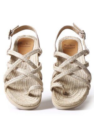 Sandales en corde beige avec des brides croisées, une boucle à la cheville et une semelle coussinée, portant l'étiquette "Toni Pons essentiel", vues de dessus.