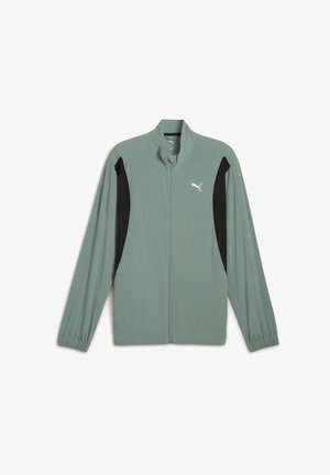 Svetlozeleno zip-up jakno z visokim ovratnikom. Ima črne stranske panele in belo Puma logo na prsih. Gladko, lahkotno tkanino.