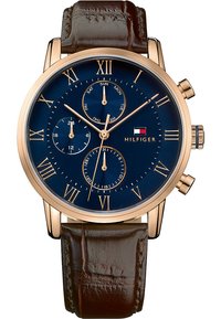 Brown leather strap watch with a blue dial, gold Roman numerals, and chronograph features. Includes date and day indicators.