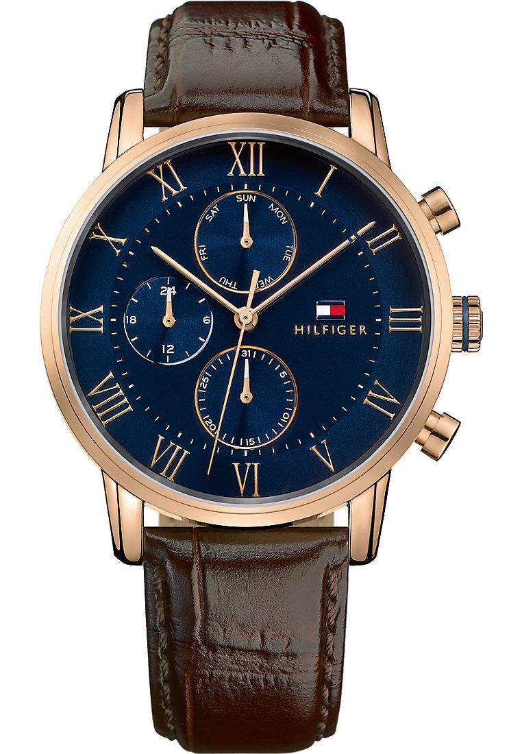 Brown leather strap watch with a blue dial, gold Roman numerals, and chronograph features. Includes date and day indicators.