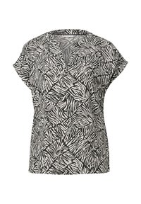 Blouse à manches courtes avec un col en V, fabriquée en tissu léger arborant un motif zèbre noir et blanc dans un design mosaïque.