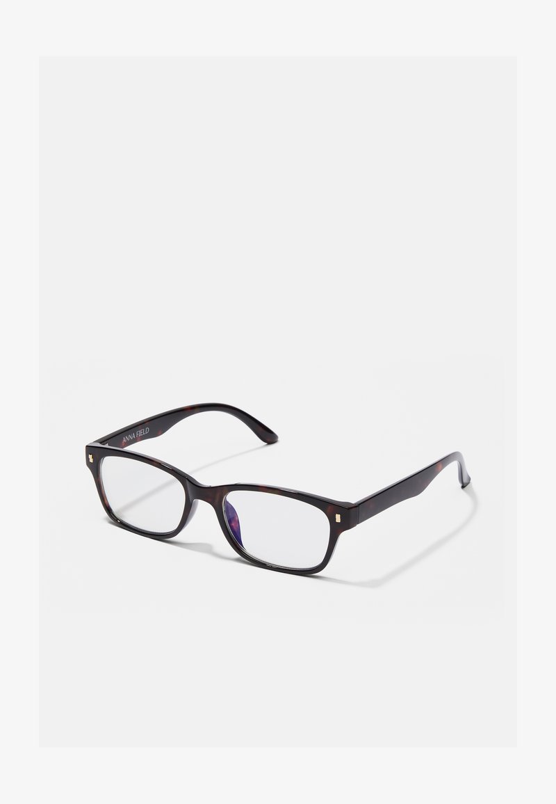Ochelari dreptunghiulari tortoiseshell maro cu lentile clare. Dispune de accente aurii pe ramă și branding "ANNA FIELD" pe templu.