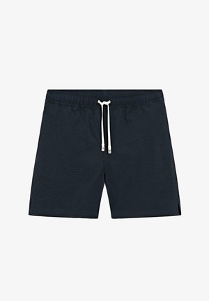 Costume da bagno blu navy con vita elasticizzata e coulisse bianca, tessuto strutturato e piccole aperture laterali sulle gambe.
