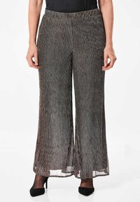 Weite Hosen im plissierten Design, hergestellt aus schwarzem und silbernem Stoff mit metallischem Glanz. Mit elastischem Bund und fließender Silhouette.