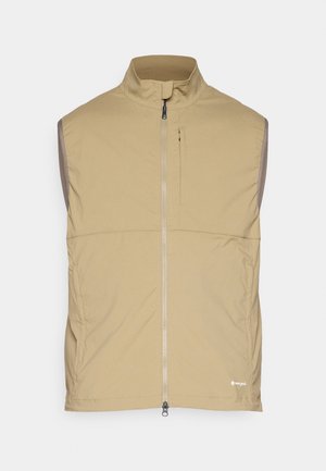 Light beige sleeveless vest with high collar, front zip closure, and left chest pocket. Smooth texture, minimal design, and no visible patterns.