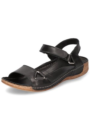 Black leather sandal with an open toe, adjustable strap, and wood-textured sole. Features silver hardware and white stitching detail.
