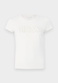 Hvit kortermet t-skjorte laget av bomull, med en hevet "GUESS" logo dekorert med små paljetter over brystet.