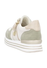 Sneaker featuring a mix of white leather and green suede, with a gold accent and a textured heel. Designed with a white striped sole.