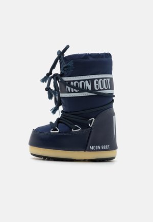 Dunkelblaue Moon Boots mit gepolstertem Obermaterial, Schnürsenkeln und einem Logoband. Mit Gummisohle und runder Zehenform. Strukturierte Oberfläche mit matter Optik.