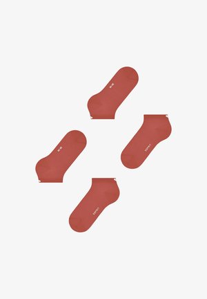 Red ankle socks made of smooth fabric, featuring a ribbed cuff and a white logo. Four pairs arranged in various orientations.