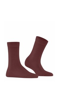 Chaussettes bordeaux avec une texture en chevrons, dotées de bords côtelés et de talons renforcés. Fabriquées à partir d'un matériau doux et élastique pour un confort optimal.