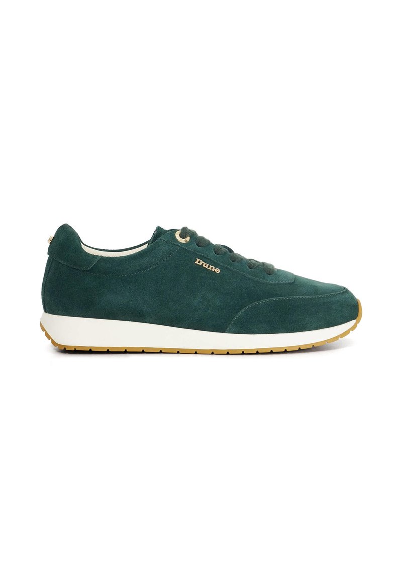 Green suede sneaker with a white rubber sole, round toe, and gold eyelets. Features a logo on the side and a smooth texture.