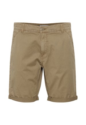 Pantalones cortos de algodón color beige con cierre de botón, dos bolsillos laterales y dobladillos enrollados. Presenta líneas limpias y una textura suave y ligera.