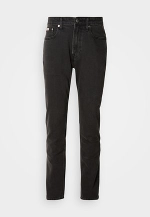 Zwarte denim jeans met een rechte pasvorm, vijf zakken, knoopsluiting en subtiele contrasterende stiksel-details.