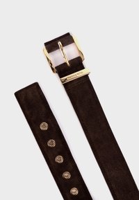 Brown suede belt with gold-tone buckle and hardware. Features five metal eyelets for adjustment. Smooth texture with clean edges.
