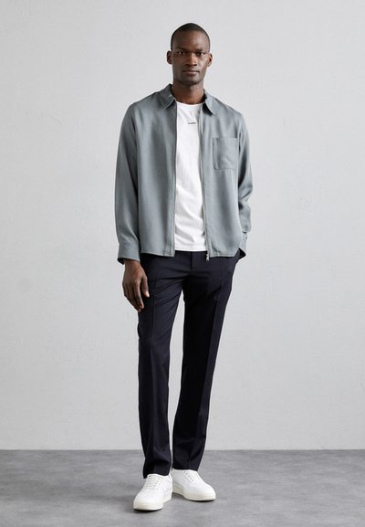 sandro ALPHA - Pantalones chinos - marine