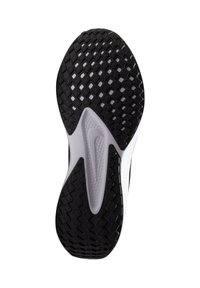 Suela de zapato de goma negra con un patrón de diamante texturizado y un distintivo logo de swoosh blanco de Nike en el centro.