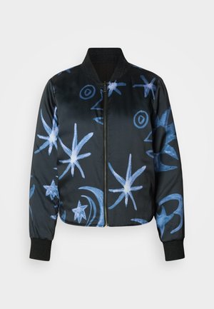 Black bomber jacket made from smooth fabric, featuring blue abstract star and moon patterns. Includes elastic cuffs and zip closure.