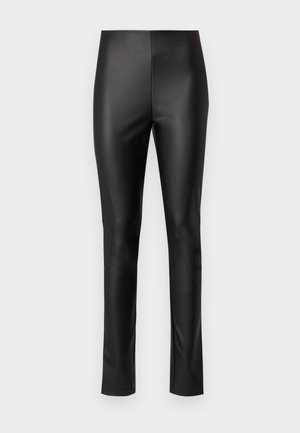 Mallas de cuero sintético negro con un diseño elegante y ajustado, que cuentan con una cinturilla elástica y sin hardware o adornos visibles.