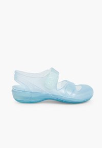 Light blue, transparent sandals with a flexible strap and Velcro fasteners, featuring a textured surface and rounded toe design.