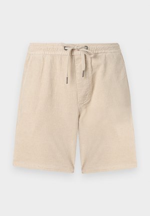 Beige kordbársony rövidnadrág gumis derekkal, zsinóros bezárással és oldalsó zsebekkel; függőleges bordázott textúrával rendelkezik.