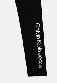 Calvin Klein Jeans LOGO UNISEX SET - Leggings - black