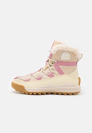 Beige and pink winter boots with faux fur collar, textile upper, lace detailing, rubber sole, and prominent tread pattern.