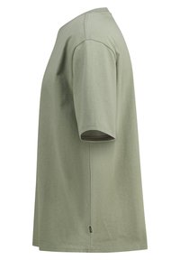 Olive green cotton t-shirt with a crew neckline, short sleeves, and a straight hem. Features a small logo at the side seam.