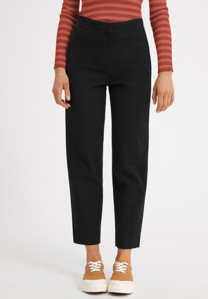 KORNELIAA - Trousers - black