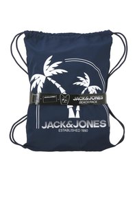 Sac de plage bleu marine à cordon de serrage avec un design de palmier blanc et le logo Jack & Jones, maintenu par une bande noire de marque.
