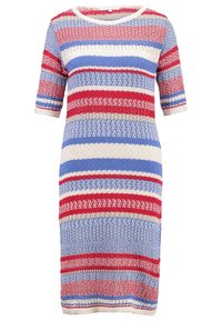 Neulemekko, jossa on vaakasuuntaisia raitoja punaisena, sinisenä ja kermanvärisenä. Lyhyet hihat ja pyöreä pääntie, jossa on teksturoitu kangas.