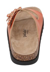 Orange slip-on sandal with a soft, textured insole and cork midsole, featuring decorative chains and accents on the upper.