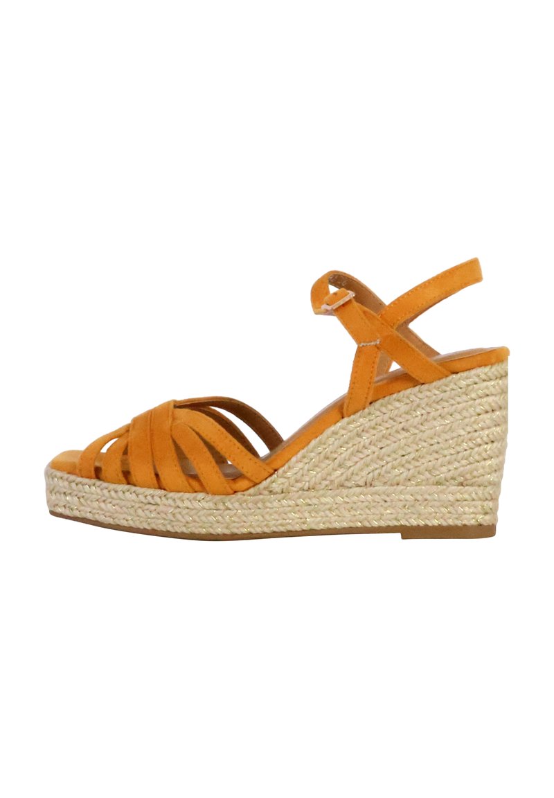 Orange suede wedge sandals with woven jute heel, featuring crisscross straps and an ankle strap for secure fit.
