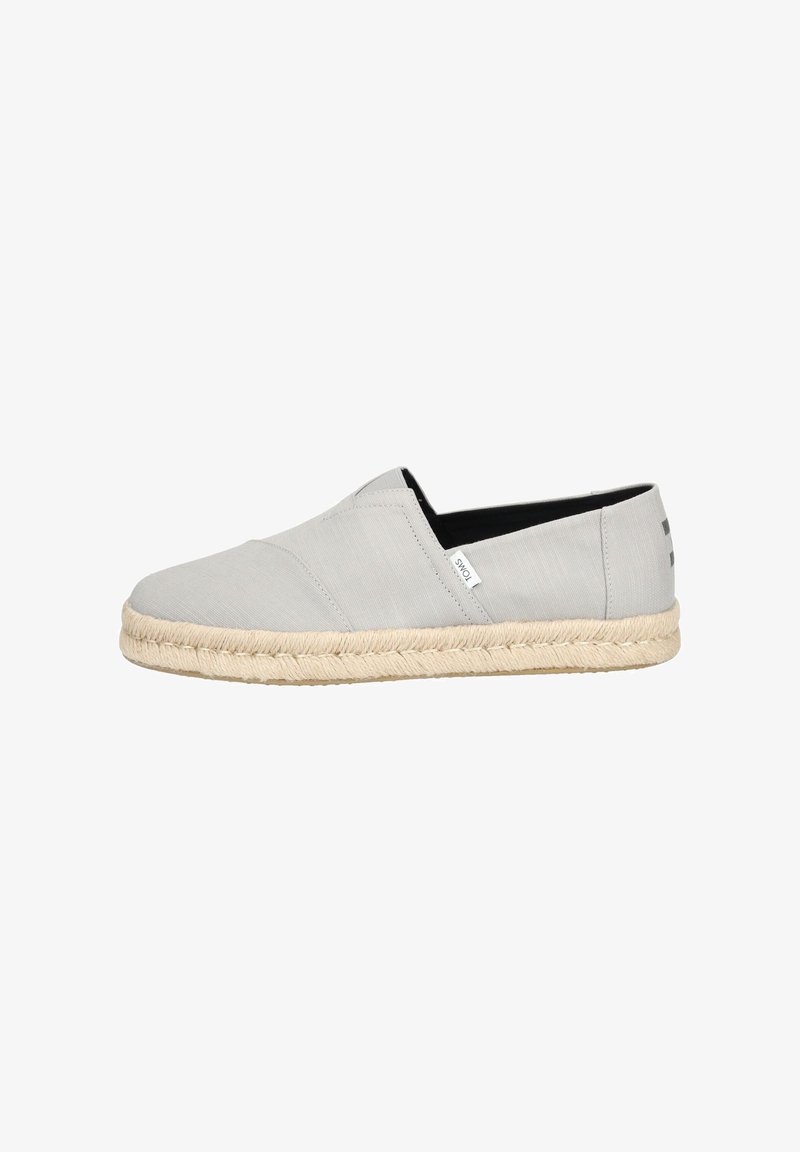 Gray slip-on shoe made of textile with a rounded toe, jute rope sole, and black inner lining. Features subtle stitching and logo detail.
