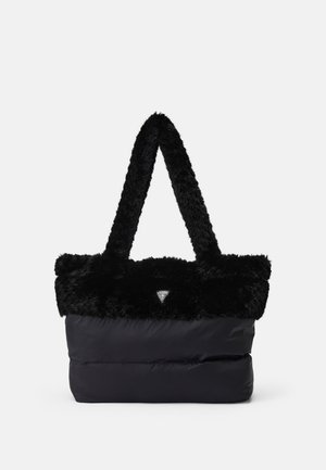 Sac cabas noir avec poignées douces et poilues, corps en tissu lisse, et petit logo triangulaire au centre avant.