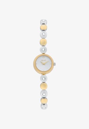 Ronde zilveren en gouden horloge met een witte wijzerplaat, kristalaccenten en een flexibele metalen band met circulaire schakels in afwisselend kleuren.
