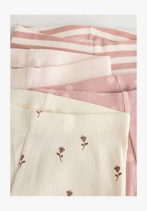 Žebrované legíny v smotanových a ružových odtieňoch; jedny kombinujú solidnú ružovú s bielymi pruhmi, druhé sú smotanové s hnedými kvetinovými vzormi.