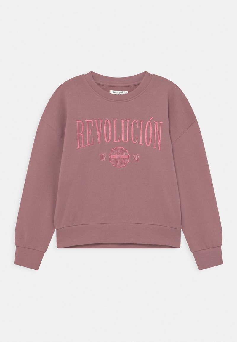 Sudadera de color rosa polvo, hecha de tela suave. Cuenta con "REVOLUCIÓN" en bordado rosa en el pecho y un dobladillo corto.