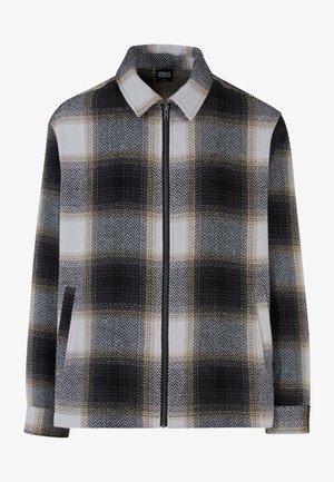 Giacca con collare in un motivo a scacchi, caratterizzata da tonalità di nero, bianco e beige. Chiusura con zip e due tasche laterali. Texture morbida.