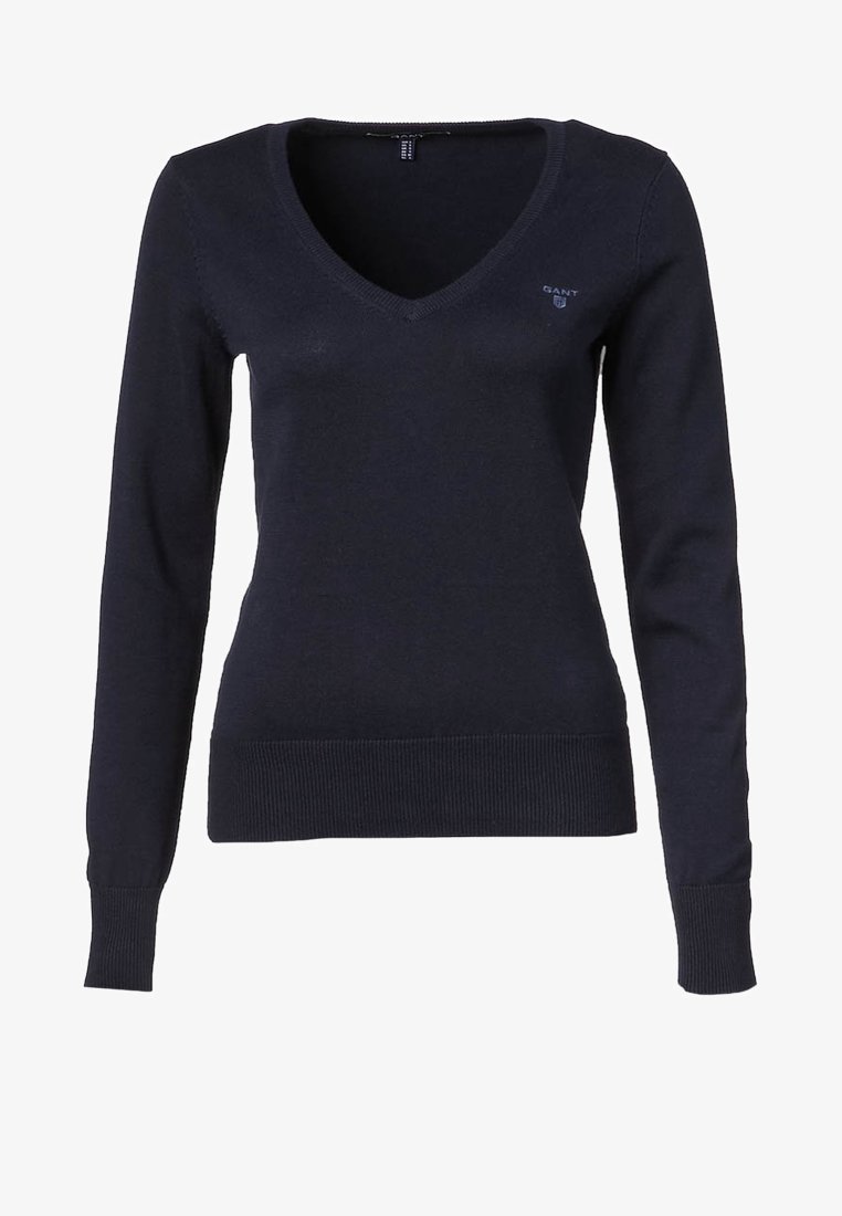 Pull bleu marine à manches longues avec col en V, poignets et ourlet côtelés, avec un petit logo GANT sur le côté gauche de la poitrine.