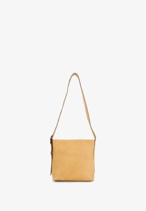 Tan leather shoulder bag with a smooth texture, featuring a long adjustable strap and a zip closure. Minimalist rectangular design.