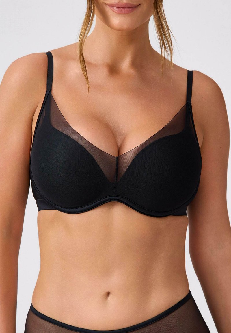 Czarny biustonosz z fiszbinami, siateczkową nakładką na miseczkach, regulowanymi ramiączkami, bezszwowym wykończeniem i gładką fakturą.