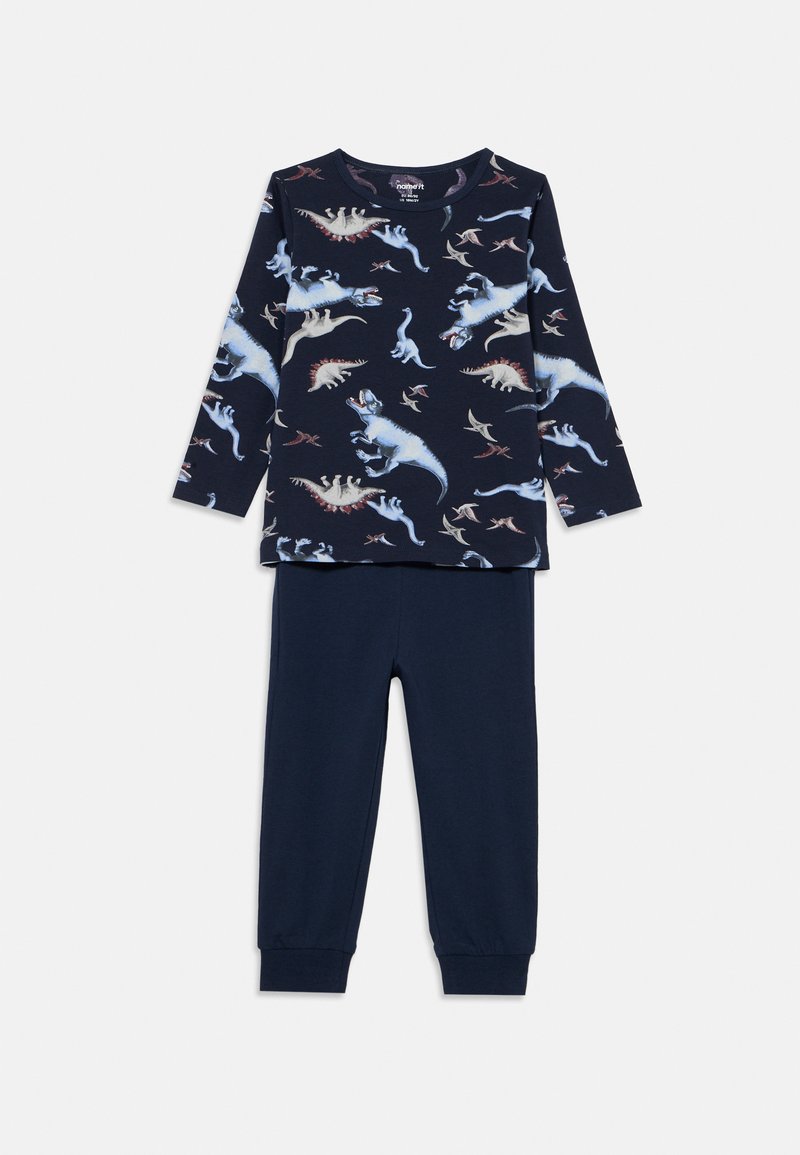 Set di pigiama in cotone blu navy composto da maglia a maniche lunghe con stampa di dinosauro e pantaloni abbinati in tinta unita con polsini a coste. Tessuto morbido e traspirante.