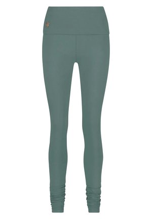 Groene, high-waisted leggings gemaakt van rekbaar materiaal. Bevat geraffineerde details bij de enkels en een klein logo nabij de tailleband.