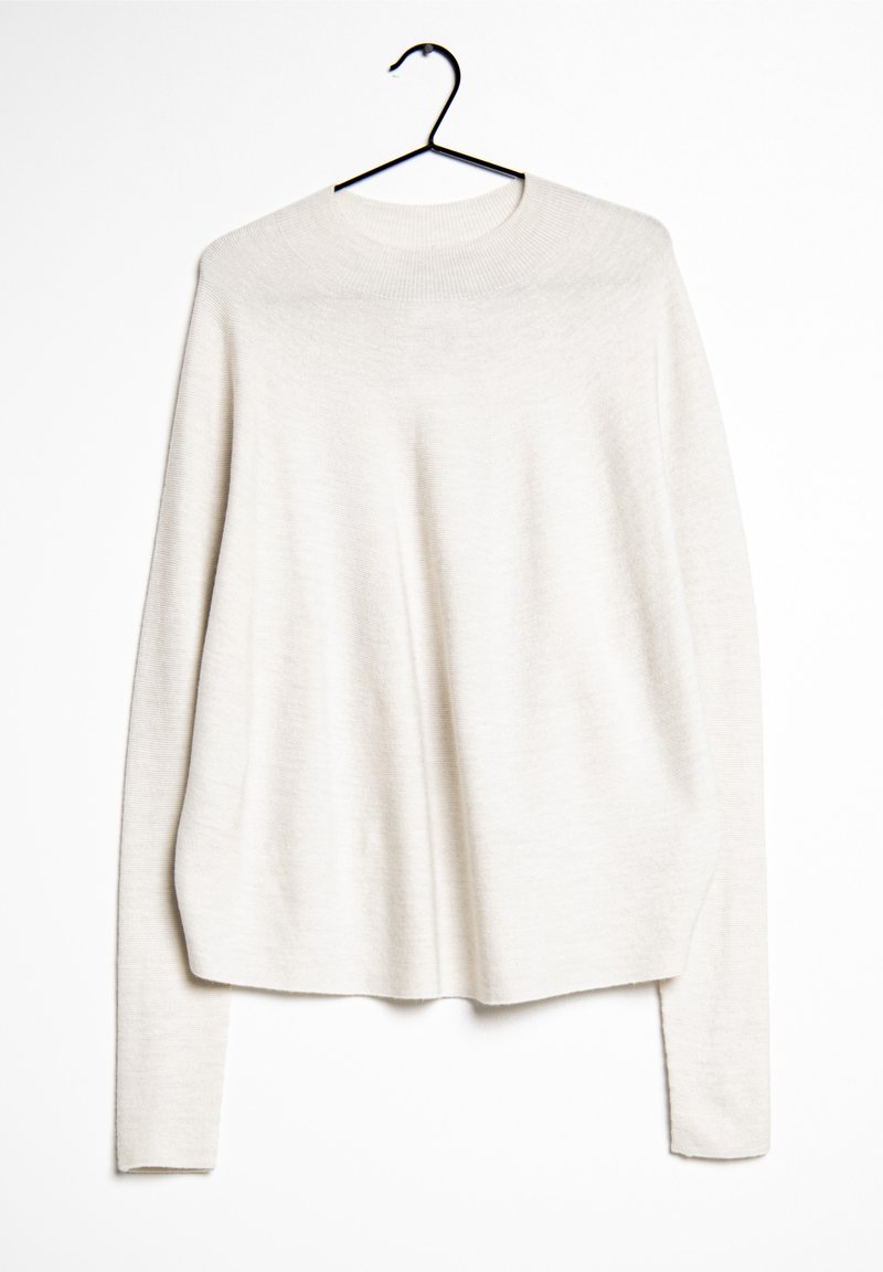 Maglione a maglia beige chiaro con maniche lunghe, scollo rotondo e vestibilità rilassata. Realizzato in materiale morbido con una leggera texture e senza motivi notevoli.
