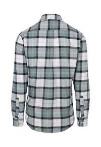 Overhemd met lange mouwen en knopen, met een groot ruitpatroon in lichtgrijs, wit en zwart, gezien vanaf de achterkant.